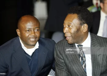 Pele raising Abedi Pele's hand