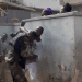Watch as gun-wielding soldiers fight NDC executive for denying them access to polling centre in Obuasi