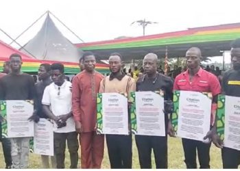 A photo of the 13 residents who were honoured by the president