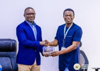 John Jinapor shaking hands with Mr. Edmond Kombat, TOR MD